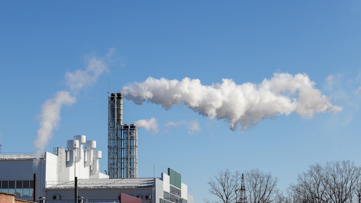 Photo smoke comes out of the power plant pipe