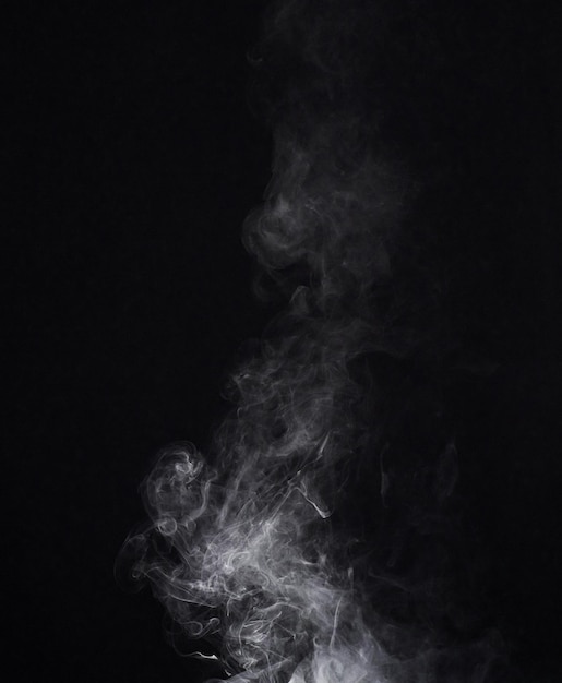 Smoke dark background and mist fog or gas on mockup space wallpaper Cloud smog and magic effect on black backdrop of steam with abstract texture pollution pattern or incense vapor moving in air