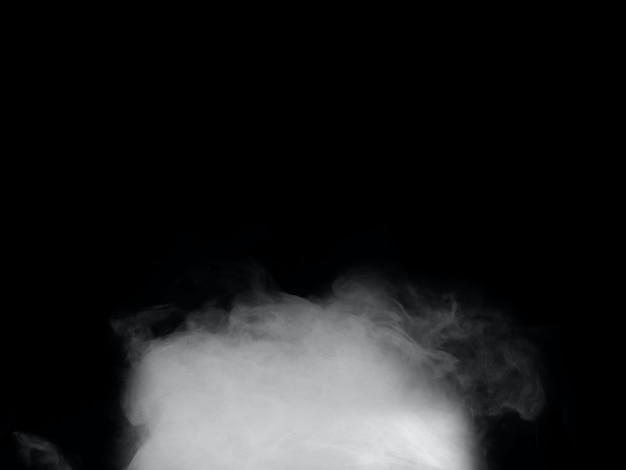 A smoke in the dark with a black background