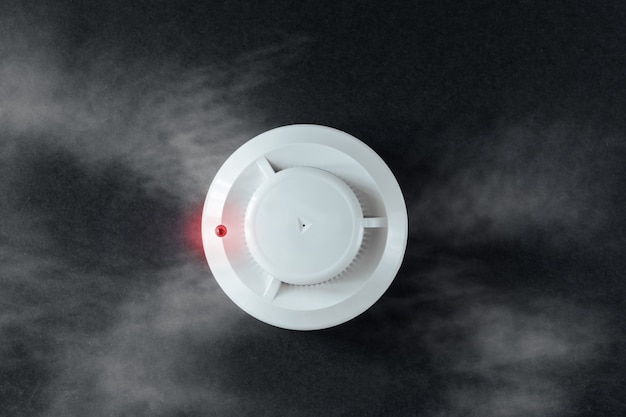 Photo smoke detector and fire detector on a black background