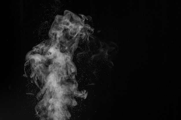 Smoke fragments on a black background.