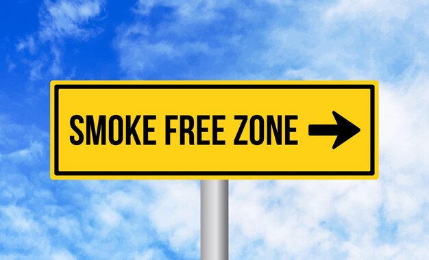 Smoke free zone road sign on sky background