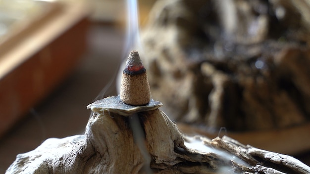 Smoke from burning aromatic incense burner