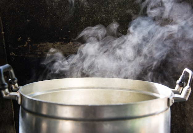 Photo smoke from hot water in the cooking pot soft blur and soft focus