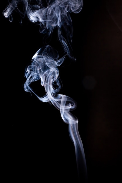 Smoke motion on black surface.