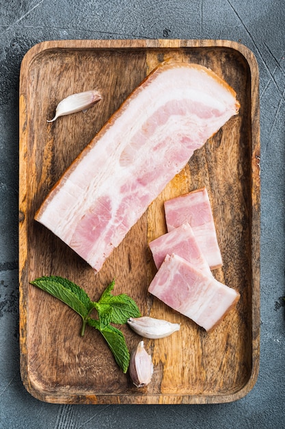 Smoked bacon on wooden board