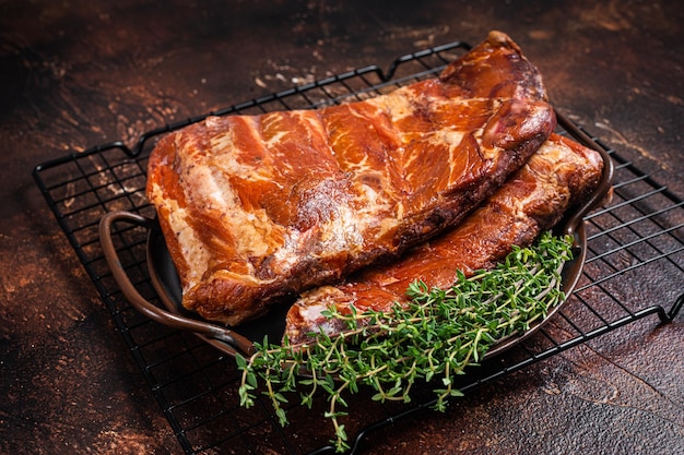 Smoked Barbecue Pork Ribs Sparerib in kitchen tray Dark background Top view