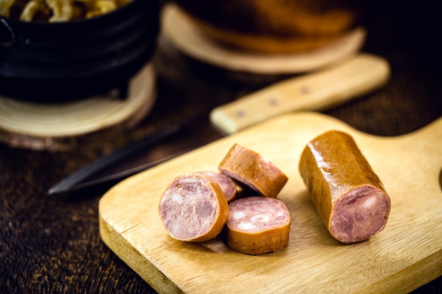 Smoked Brazilian sausage, cut into pieces. Culinary ingredient