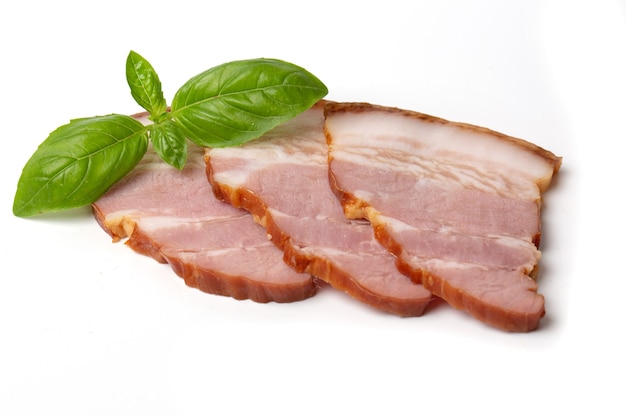 Photo smoked brisket pork loin decorated green basil leaf, isolated on white background. high resolution image.