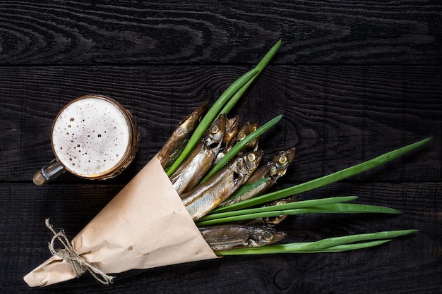 Smoked capelin with green onions and beer