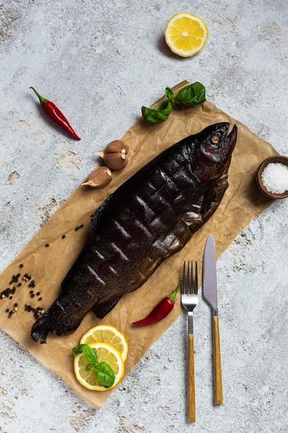 Smoked delicious whole trout on parchment Hot smoking Snack Top view