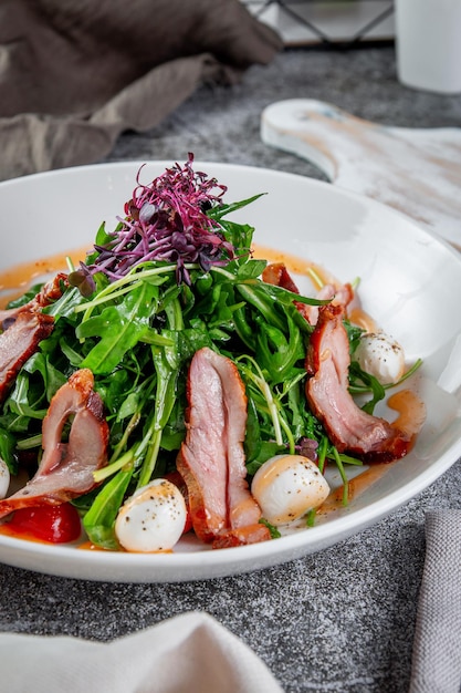 Smoked duck breast salad with vegetables and spices