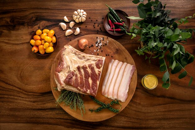 Photo smoked fatty bacon on rustic wood table with natural ingredients