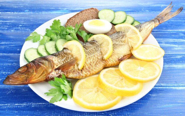 Smoked fish on plate close up