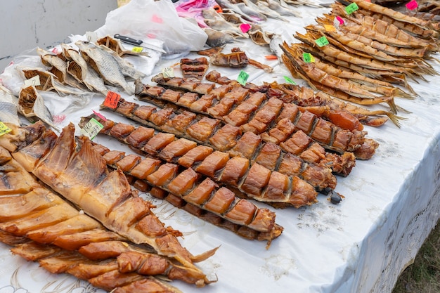 Smoked fish for sell in street food market, Ukraine, close up