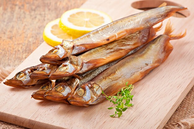 Smoked fish with slices of lemon