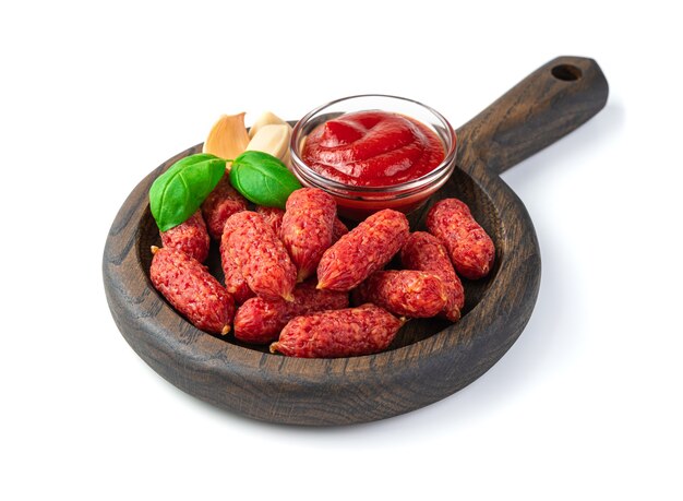 Smoked garlic sausages with basil isolated on a white background