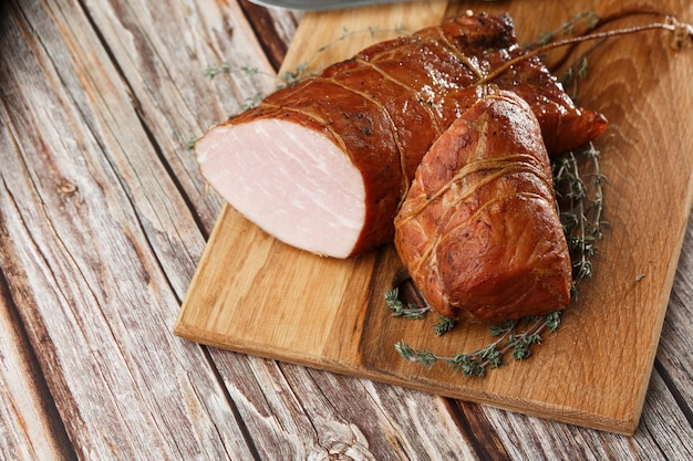 Smoked ham on a chopping board.