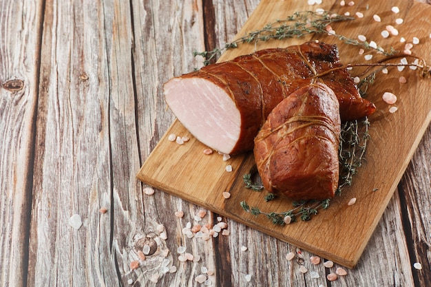 Smoked ham on a chopping board.