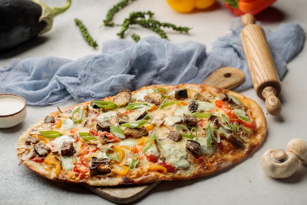 Smoked Herbs Vegetable Pizza served in dish isolated on table top view of arabian food