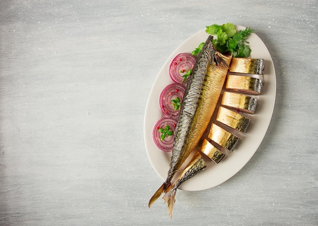 Smoked mackerel top view with spices on a wooden table no people selective focus