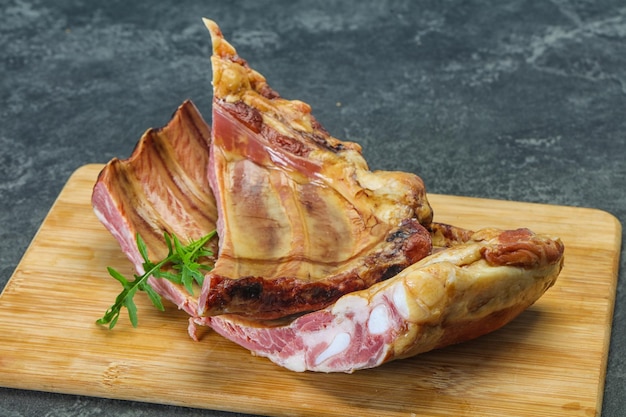 Smoked pork ribs over the wooden background