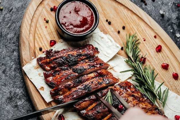 Smoked rib with barbecue sauce delicious appetizing dinner
barbecue pork spare ribs background image copy space