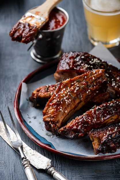 Smoked Roasted pork ribs on the plate. Delicious grilled bbq ribs