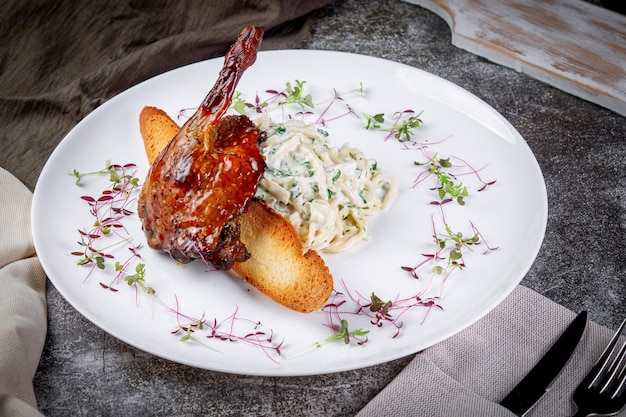 Smoked roasted rabbit leg Served with mousse Three cheese crusty bread with herbs roasted zucchini