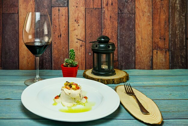 Smoked salad with vinaigrette served on a white plate