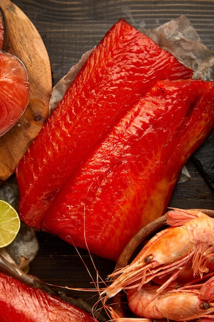 Smoked salmon fish over rustic background