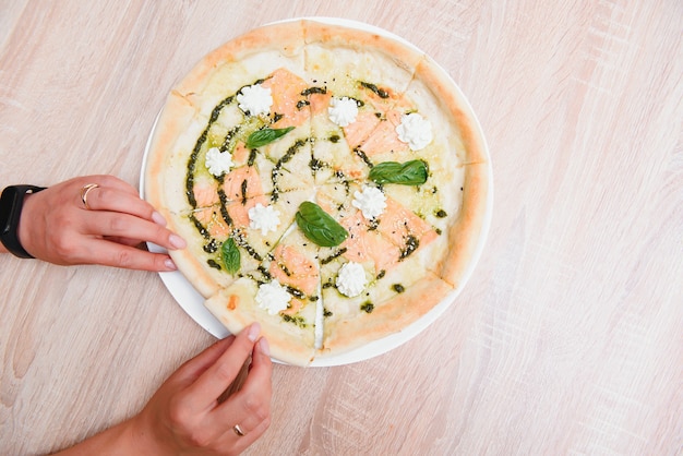 Smoked salmon pizza isolated on white background - Italian food style