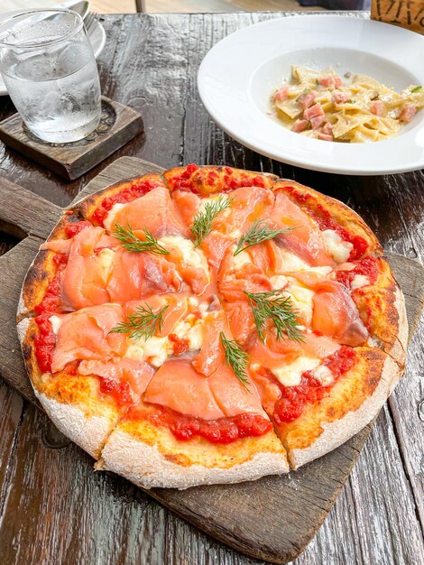 smoked salmon pizza on wood tray