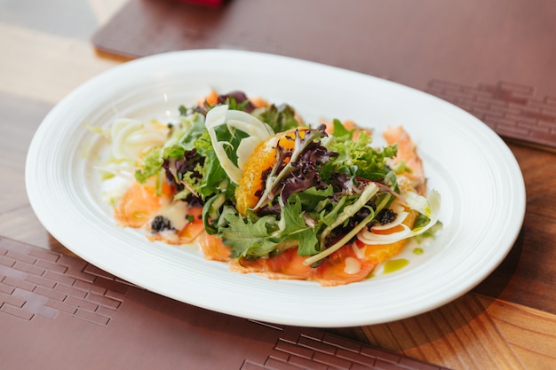 Smoked Salmon Pomelo Salad include green oak, red leaf lettuce and onion