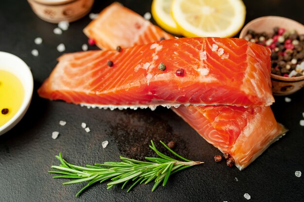 smoked salmon with spices on a stone background