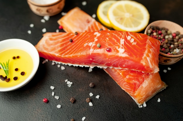 smoked salmon with spices on a stone background