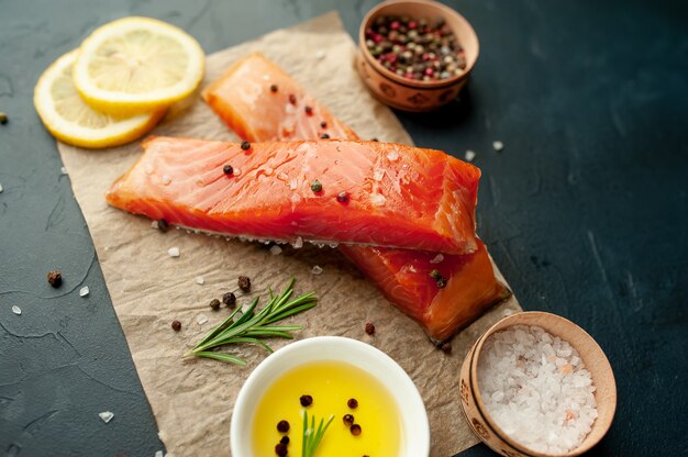 smoked salmon with spices on a stone background