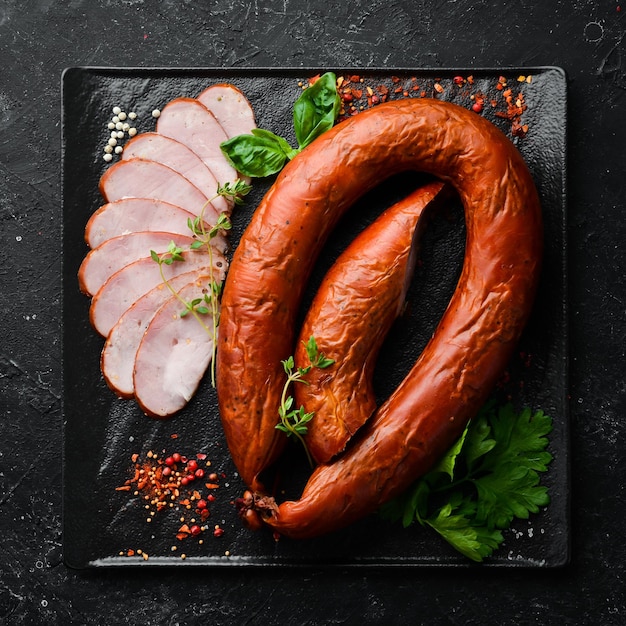 Smoked sausage from whole pieces of meat Top view Free space for text