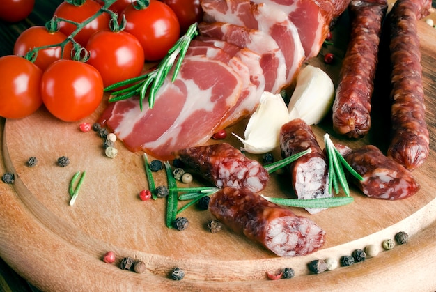 Smoked sausage with rosemary and peppercorns tomatoes and garlic