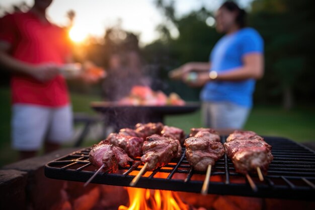 写真 背景に人がいるバーベキューのスモーキーなオーストラリアの羊肉