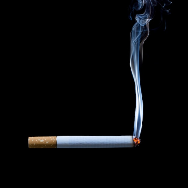 smoking cigarette on black background