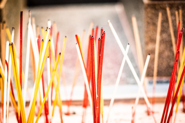 Smoking incense stick on a stand