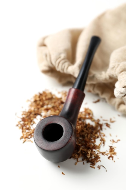 Smoking pipe tobacco and sack on white background