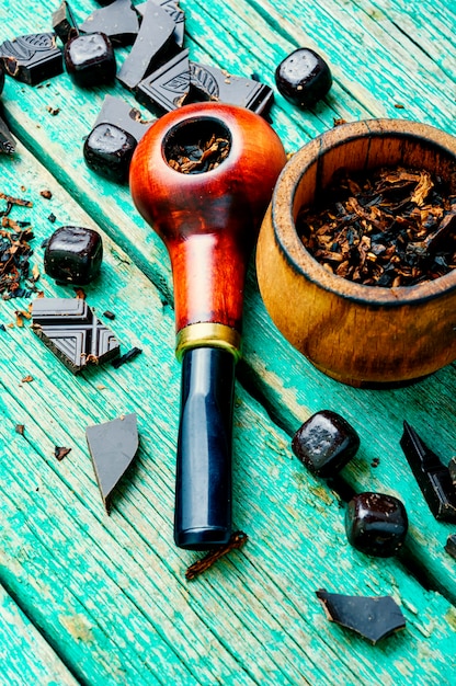 Smoking pipe with chocolate tobacco.