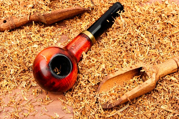 Smoking pipe on a wooden table