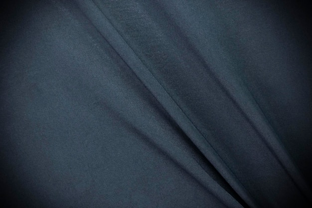 Smooth and dark blue fabric elegant silk or satin and luxury cloth texture