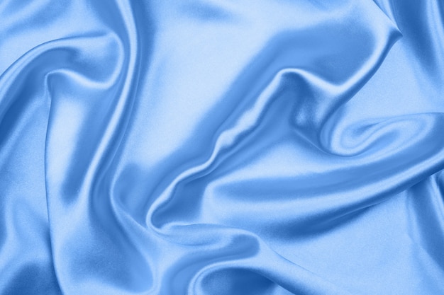 Smooth elegant blue silk or satin texture can use as abstract background, fabric