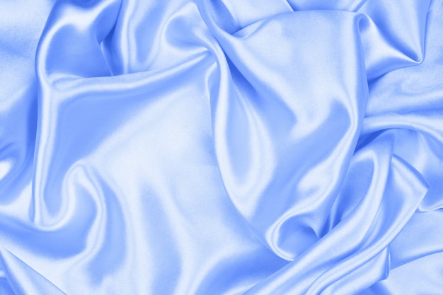 Smooth elegant blue silk or satin texture can use as abstract background, fabric