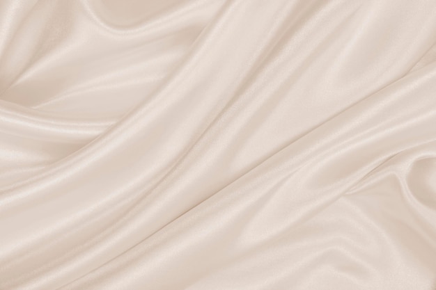 Smooth elegant golden silk or satin luxury cloth texture as wedding background