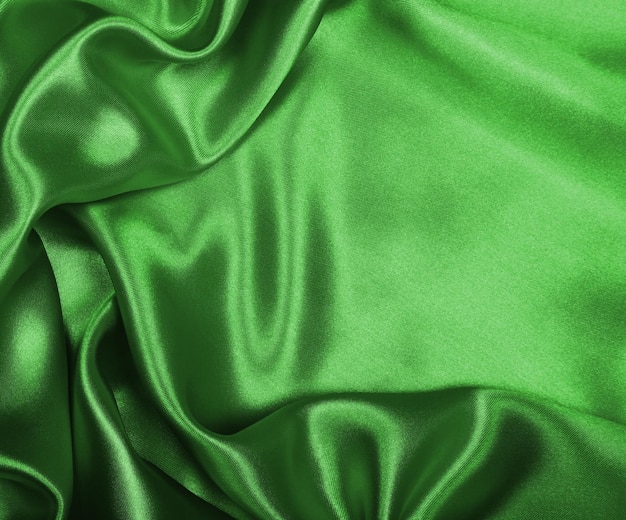 Smooth elegant green silk or satin as background